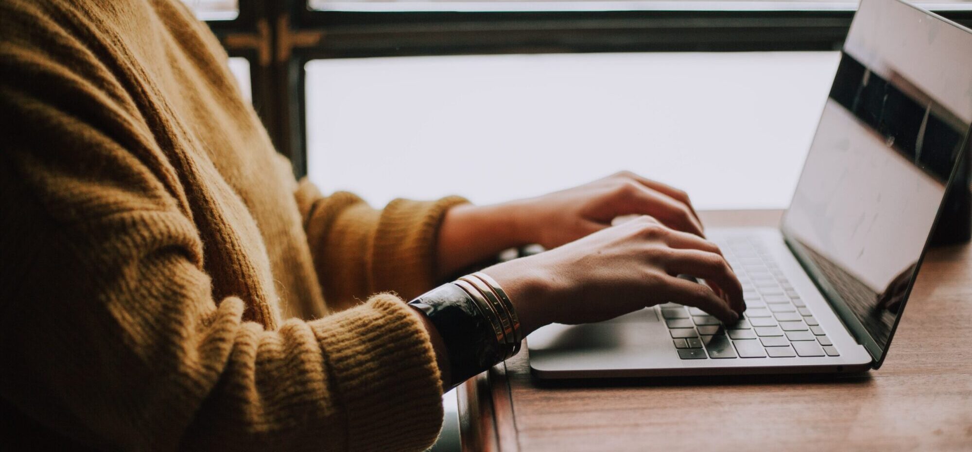 Person typing on computer